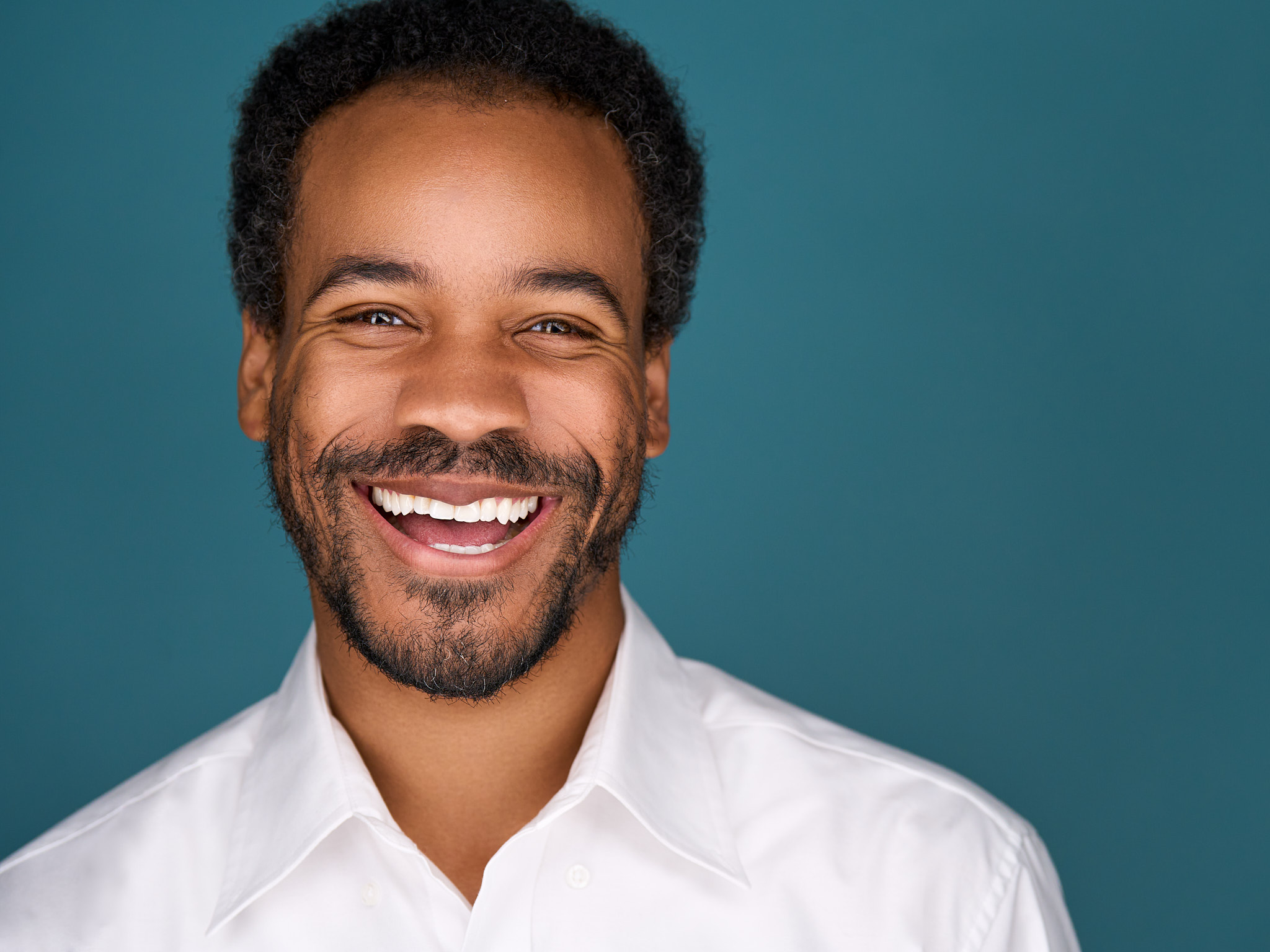 headshot of black man smiling
