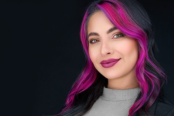 young woman with pink streaks of hair